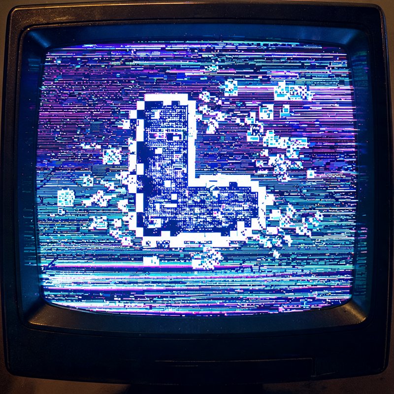 Vintage CRT monitor displaying glitching pixelated thumbs up icon with colorful static scan lines
