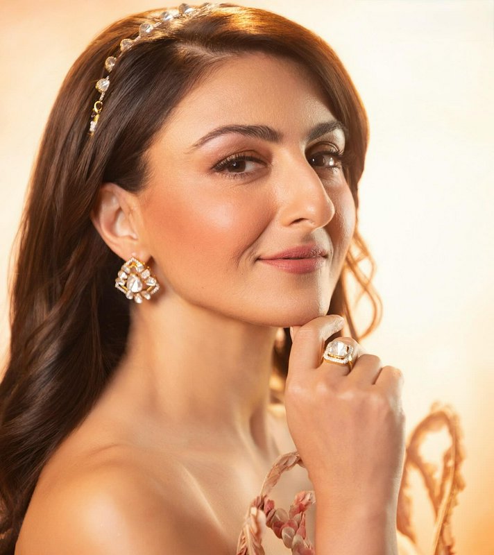 Close-up portrait of Bollywood actress Soha Ali Khan wearing kundan diamond jewelry, crystal head...