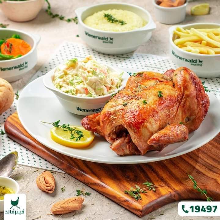 Golden herb roasted whole rotisserie chicken meal with coleslaw sides, Wienerwald restaurant serv...