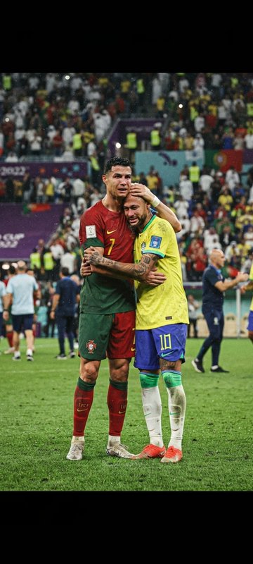 Cristiano Ronaldo comforts tearful Neymar in an embrace on the Qatar 2022 World Cup soccer pitch.