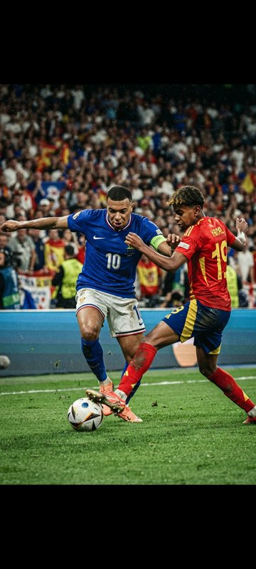 Kylian Mbappe and Lamine Yamal compete for ball possession during a France vs Spain international...