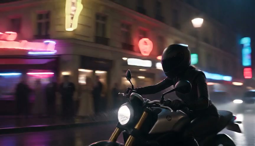 Helmeted motorcyclist on a street bike waits on a rain-slicked neon-lit city street at night