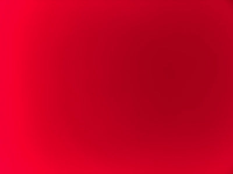 Smooth red gradient background with vibrant to deep crimson tones
