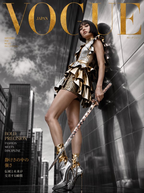 Vogue Japan September 2026 cover, model in metallic couture holding an ornate katana against an u...