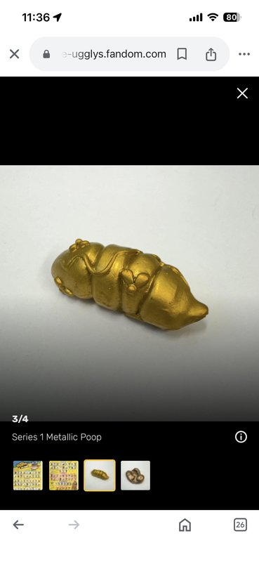 Metallic gold Series 1 E-Ugglys poop novelty collectible figurine, displayed on a fandom wiki mob...