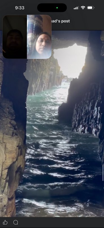 Screenshot of picture-in-picture video call overlayed over a view of churning ocean inside a rock...