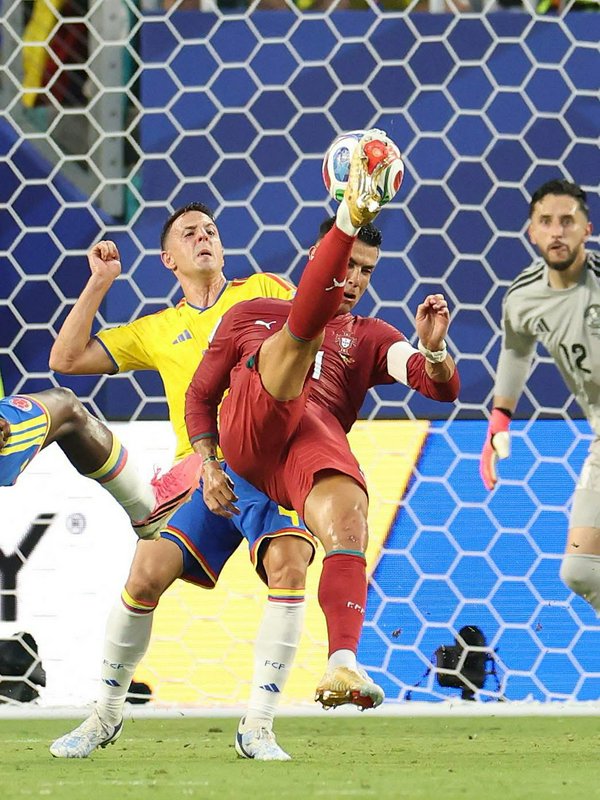 Cristiano Ronaldo performs a high acrobatic kick to contest the ball during a Portugal vs Colombi...