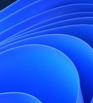 Abstract layered flowing curved wave background, with overlapping soft gradient blue rounded shap...