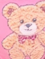 Cute illustrated tan teddy bear with a pink bow tie against a solid bright pink background