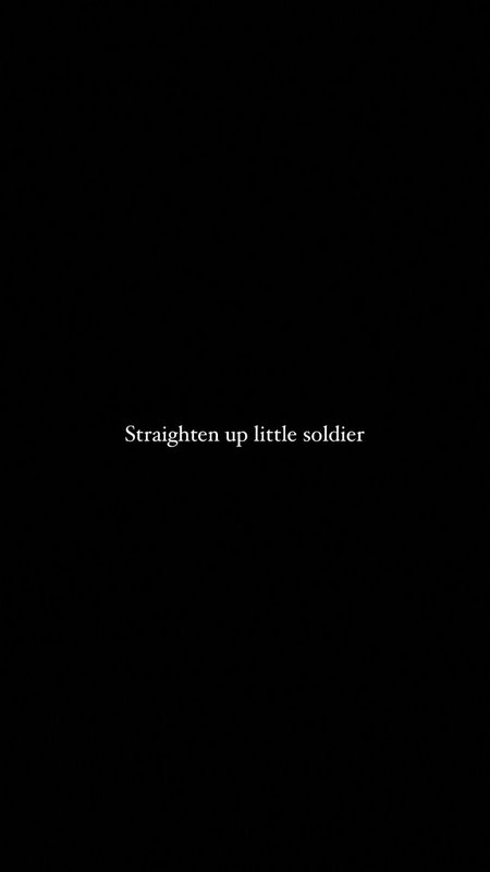 Centered white serif text reading "Straighten up little soldier" on a subtly textured solid black...