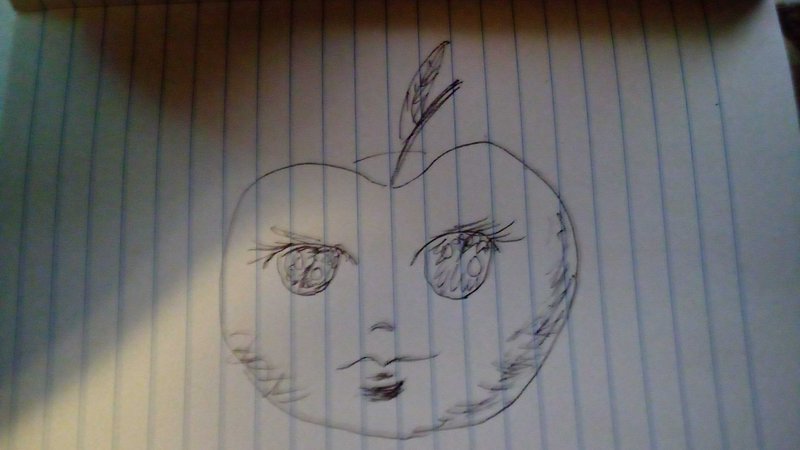 Hand drawn pen sketch of an anthropomorphic apple face on lined notebook paper