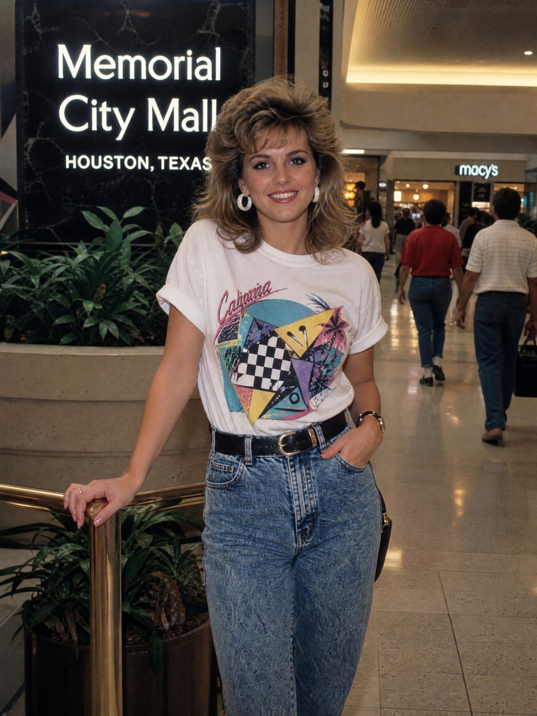 Woman in white graphic tee and high-waisted jeans posing inside Memorial City Mall, Houston.