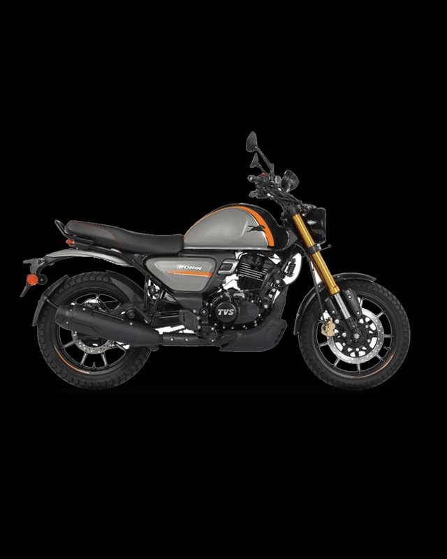 Side profile studio shot of a matte grey TVS Ronin scrambler motorcycle with orange accents on a ...