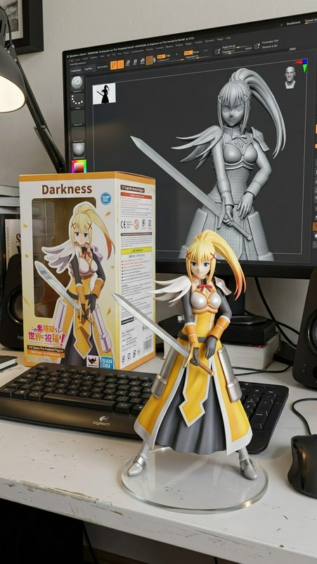 Painted Darkness Konosuba anime figure, retail box, and 3D sculpt preview on a creator work desk