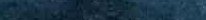 Horizontal abstract textured background in soft varying shades of dark navy blue and muted teal