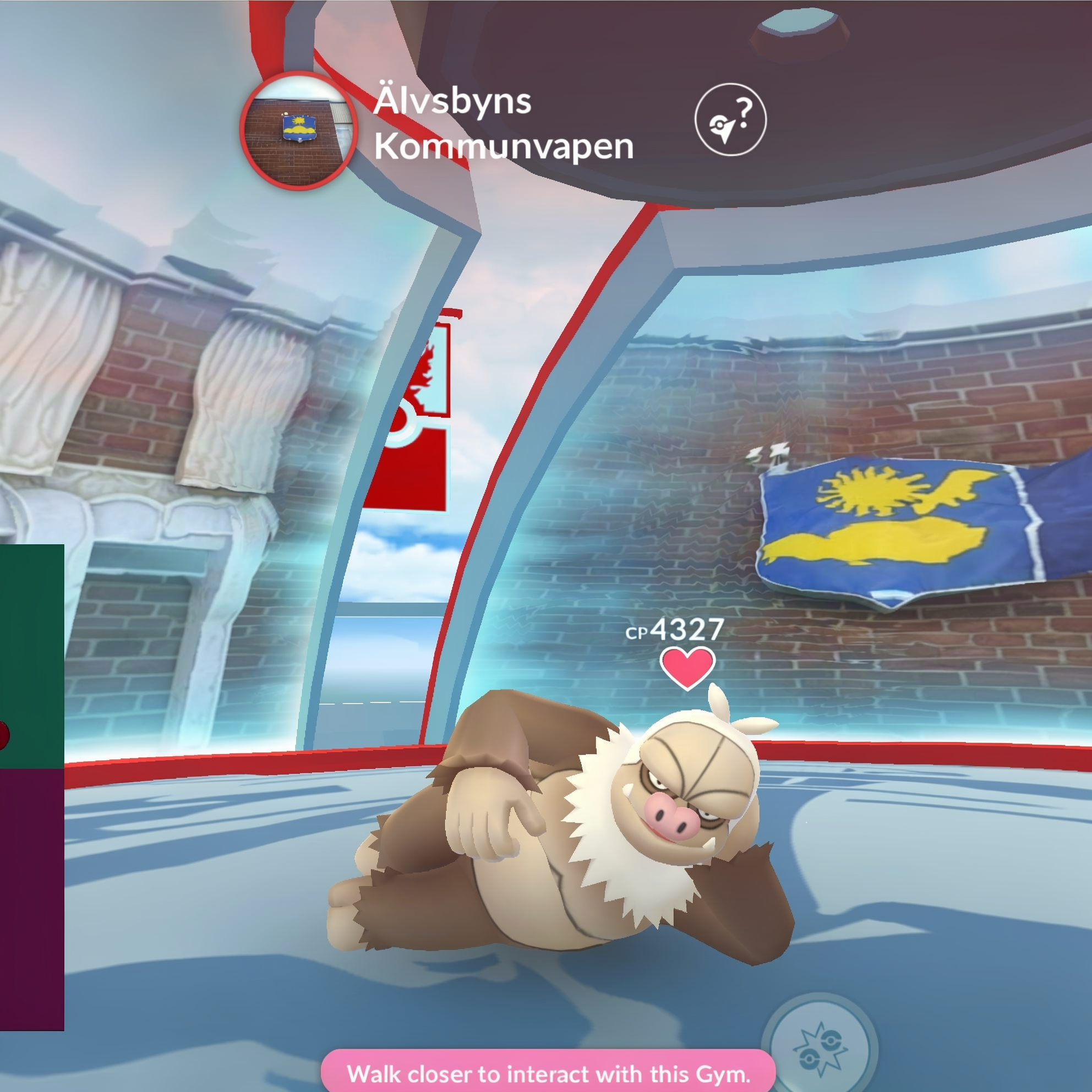 High CP Slaking lounging inside a Pokemon Go gym at the Älvsbyns Kommunvapen location