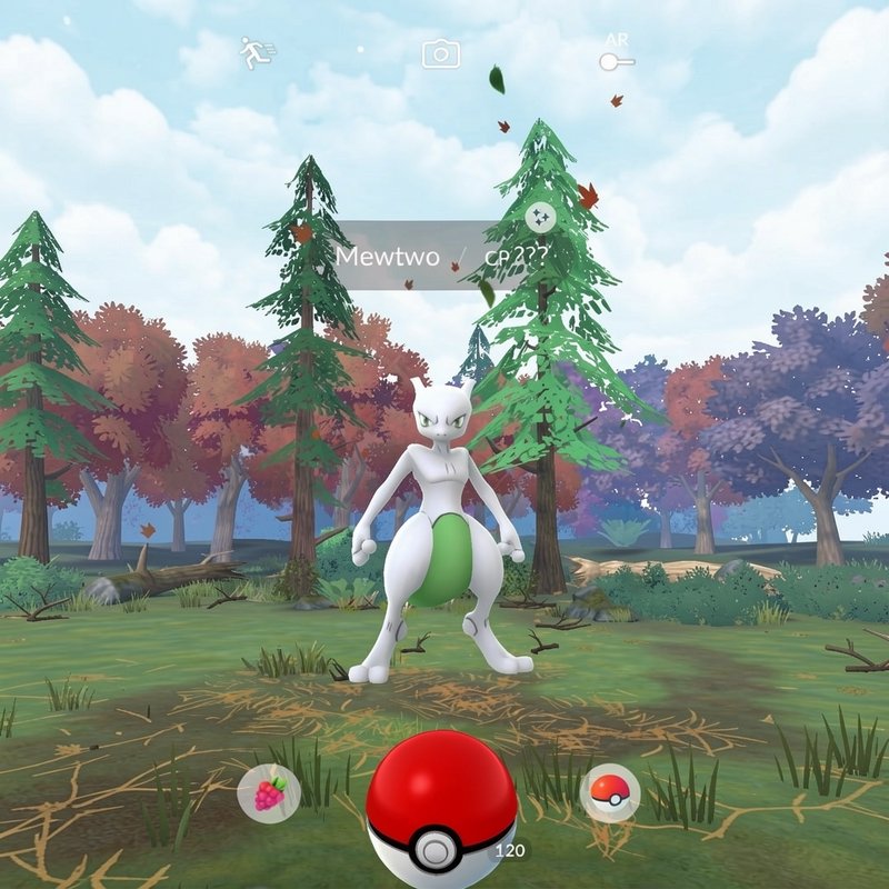 Pokemon Go gameplay screenshot showing a wild legendary Mewtwo encounter in a stylized autumnal f...