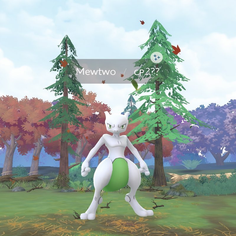 Shiny Mewtwo wild encounter screenshot from Pokemon Go, standing in a stylized autumn forest game...