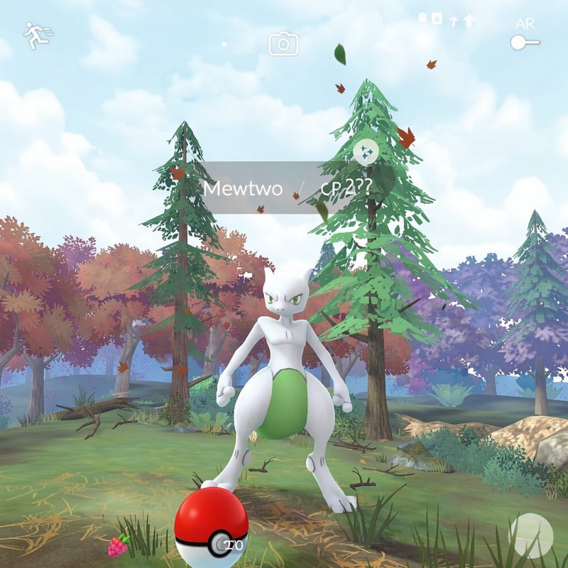 In-game Pokemon Go screenshot showing a shiny Mewtwo wild encounter set in a stylized autumn fore...
