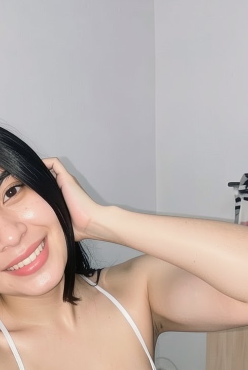 Smiling young woman with sleek black hair takes a casual at-home selfie, hand resting behind her ...