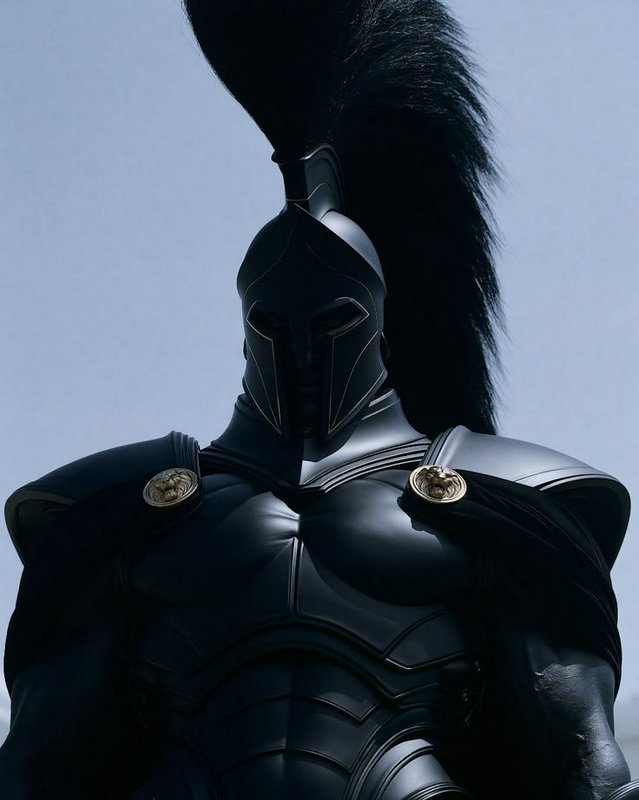 Low angle portrait of a towering muscular spartan warrior in sleek black plumed armor against a p...