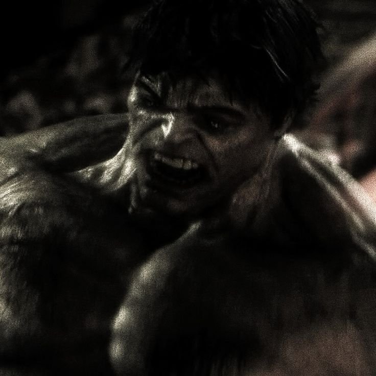 Enraged snarling muscular monstrous humanoid in dark moody close-up portrait