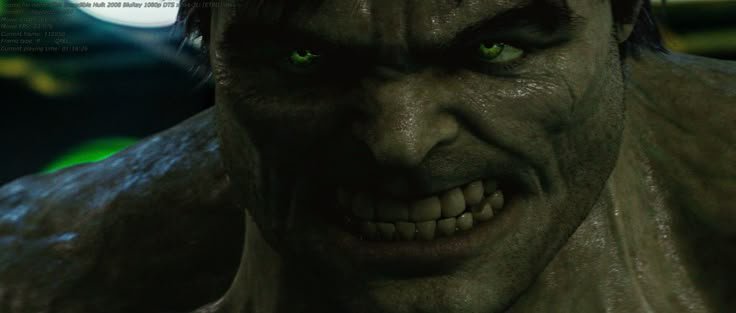 Close-up of snarling green-skinned Hulk staring menacingly at the viewer with glowing bright green eyes