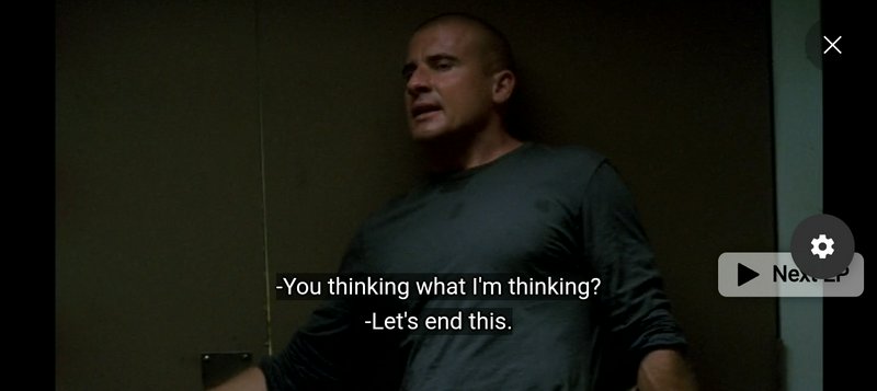 Dominic Purcell as Lincoln Burrows appears in a dim Prison Break scene with overlaid dialogue sub...