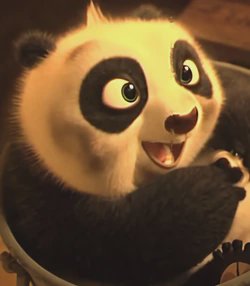 Close up of delighted young Po from Kung Fu Panda looking upward with an excited open smile