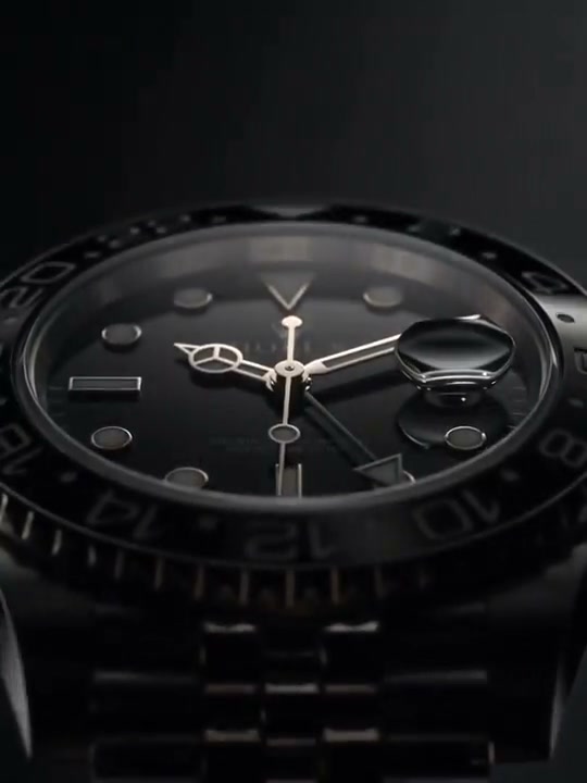 Close-up of a sleek all-black luxury diver watch with polished silver hands and rotating bezel ag...