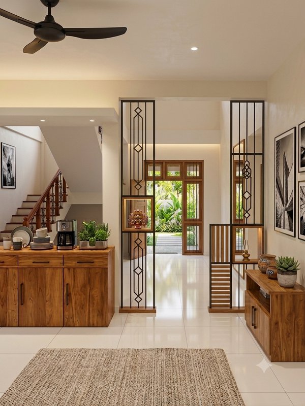 Bright modern home foyer with wooden cabinetry, geometric metal partition, and view to garden-fac...