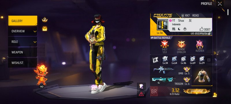 Free Fire Max player profile screen showing a female character in a yellow tracksuit with a fiery...