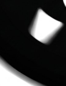 Abstract high contrast monochrome artwork with soft blurred glowing light shapes against a solid ...