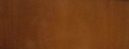 Warm matte caramel brown textured plain surface with soft subtle tonal variations