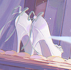 Elegant white stiletto heels with ribbon accents rest in a padded display case