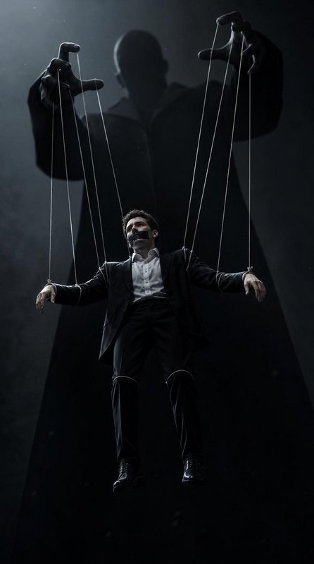Gagged businessman suspended as a marionette controlled by a giant shadow puppet master