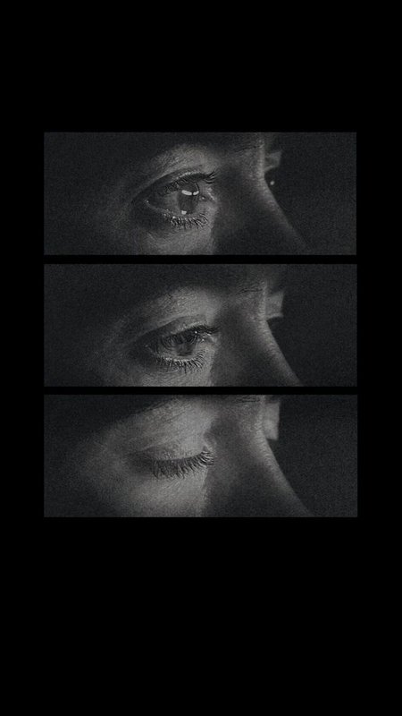 Three-panel grainy black and white sequence showing a human eye slowly closing in a blink progres...