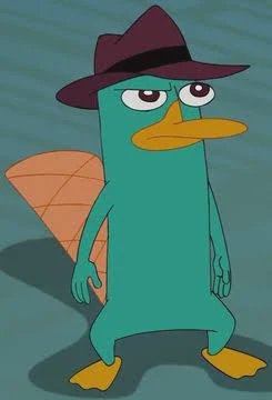 Perry the Platypus, also called Agent P, stands wearing his signature fedora with a deadpan unimp...