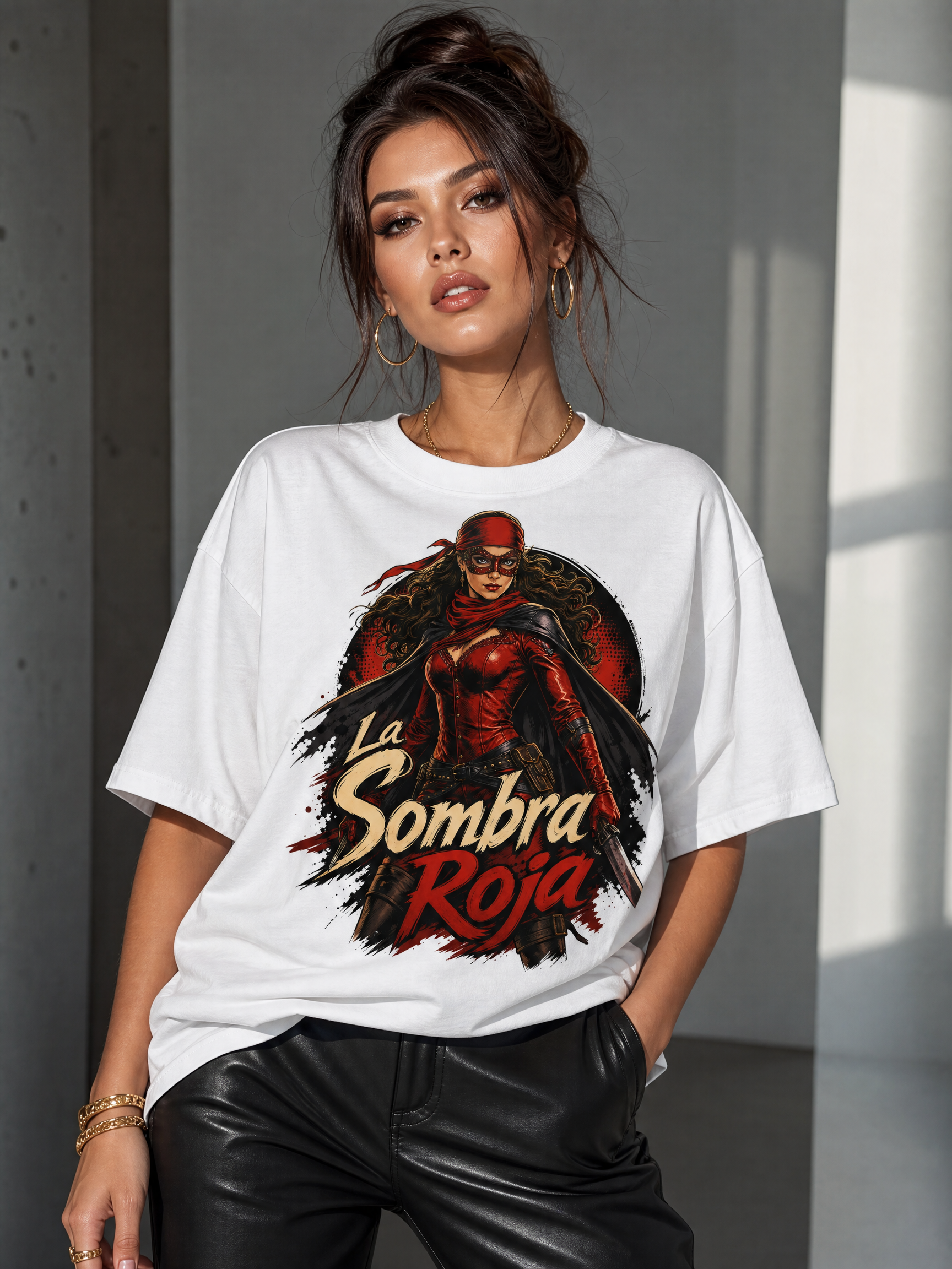Woman wearing an oversized white T-shirt with a bold red-and-black "La Sombra Roja" graphic.