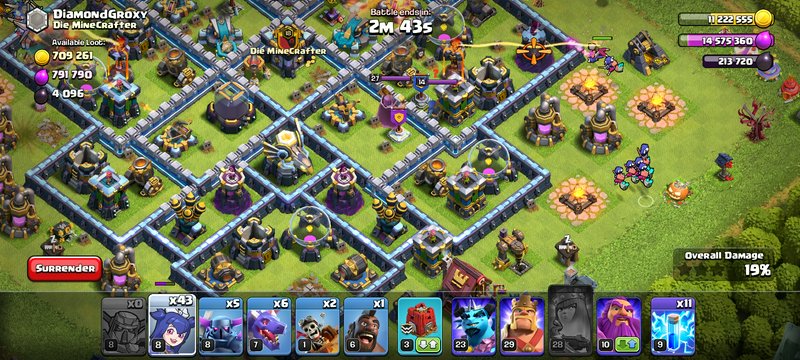 Ongoing Clash of Clans raid battle on a maxed fortified base with active troop deployment and gam...