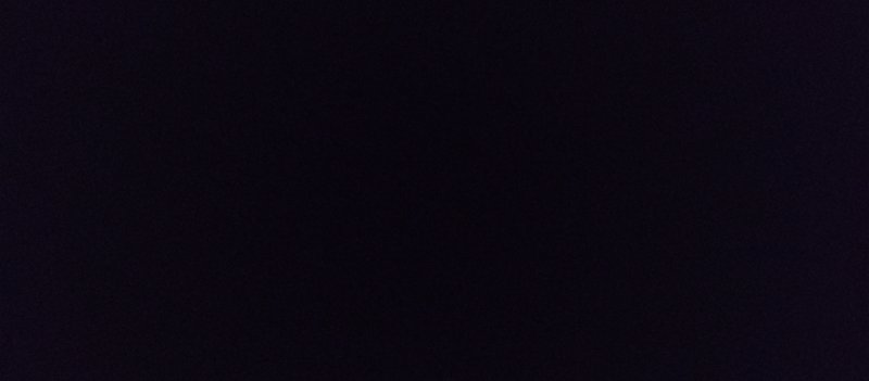Subtly grainy deep near-black dark purple solid blank background