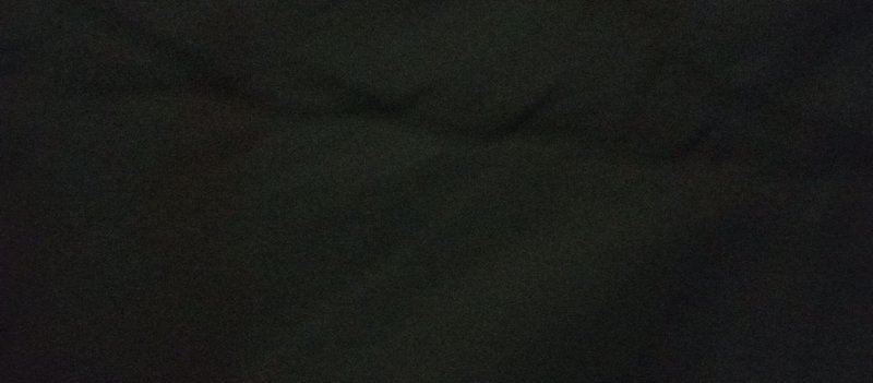 Grainy dark muted deep green and black abstract textured background