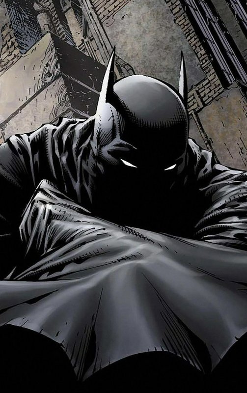 Low angle comic panel of brooding Batman leaning forward against gothic city architecture