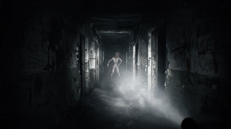 Twisted emaciated monster stands at the end of a dark decaying asylum hallway lit by a flashlight beam