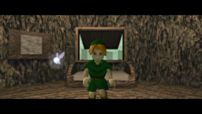 Young Link stands beside glowing fairy Navi inside a rustic treehouse in The Legend of Zelda Ocar...