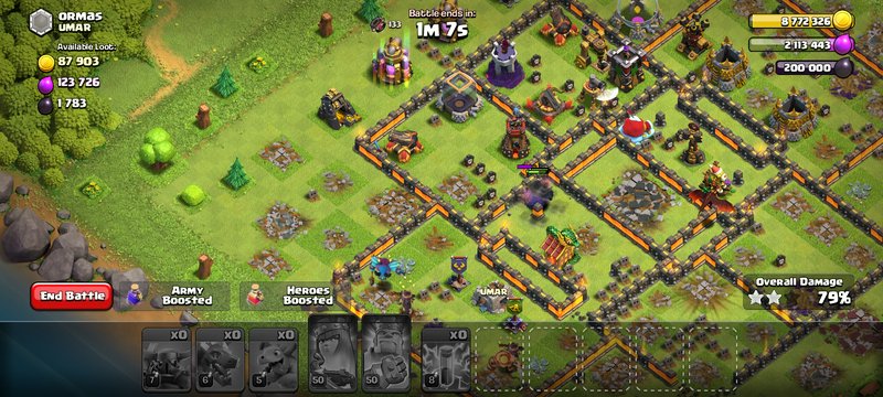 Ongoing Clash of Clans raid battle showing damage dealt to a walled player village base