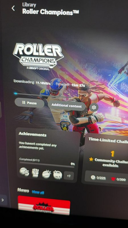 Gaming library screen displaying active Roller Champions download status and game UI elements