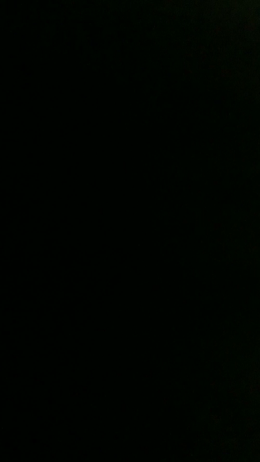 Heavily underexposed nearly all-black video frame with no clearly visible distinct subjects or ob...