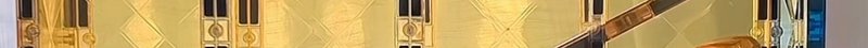 Ultra thin horizontal panoramic detail of an ornate gilded wall panel with geometric diamond patt...