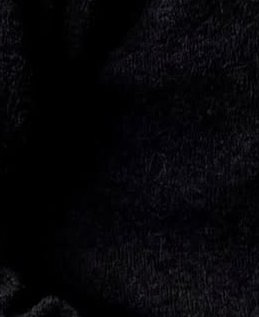 Close-up of dark black velvet fabric texture with soft sheen.